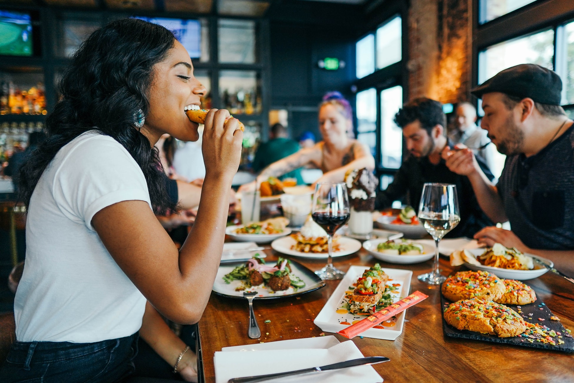 A Group of People Eating Food at a Restaurant